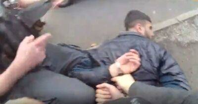 Moment unarmed officers take down gunman as children play out on streets nearby