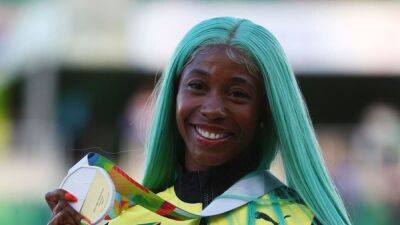 Jamaica's Fraser-Pryce keeps her wig on to reach 200m semis