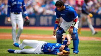 Toronto Blue Jays P Kevin Gausman leaves game after being hit on foot by liner