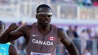 Canada's Aaron Brown sweats way to 200m final on sweltering night at athletics world