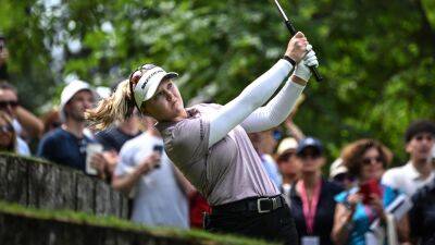 Brooke Henderson retains control of the Evian Championship as Nelly Korda wilts in the sun in the French Alps
