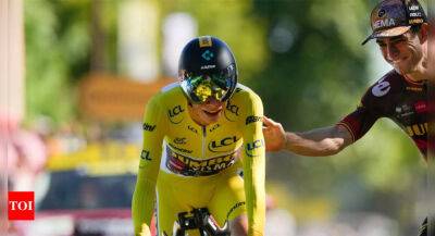 Jonas Vingegaard poised to win Tour de France as Wout van Aert claims time trial