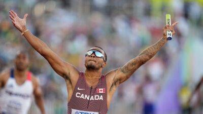 Andre De-Grasse - Aaron Brown - De Grasse leads Canada to men's 4x100m relay gold at world championships - tsn.ca - Britain - Usa - Canada - Beijing -  Doha -  Tokyo - county Bailey