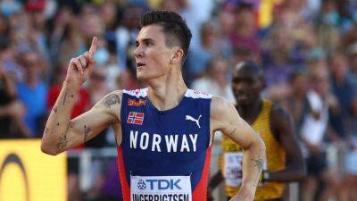 Dominant Ingebrigtsen wins world 5,000m gold
