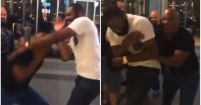 Mike Tyson and Jon Jones play-fighting on the street will never get old