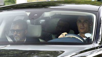 Cristiano Ronaldo arrives at Carrington with agent Jorge Mendes - in pictures