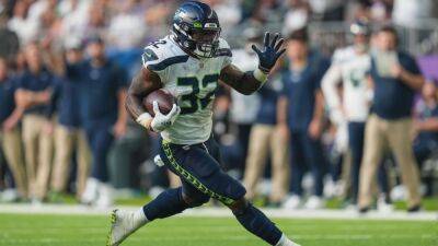 Pete Carroll - Source - Seattle Seahawks releasing veteran RB Chris Carson with failed physical designation - espn.com -  Seattle - state Oklahoma
