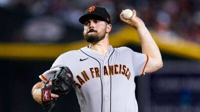 Baseball bat kicked by San Francisco Giants pitcher Carlos Rodon hits teammate Thairo Estrada