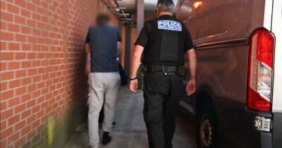 Moment police storm homes and arrest three after historic paving stones stolen from church graveyards - manchestereveningnews.co.uk - Manchester