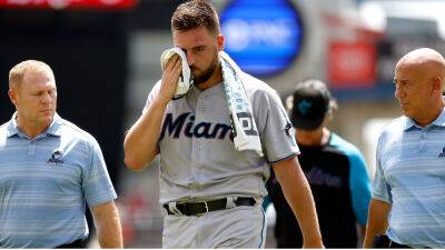 Marlins pitcher Daniel Castano walks off field after taking line drive to head