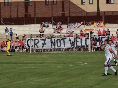 Atletico Madrid fans display “CR7 Not Welcome” banner during friendly match