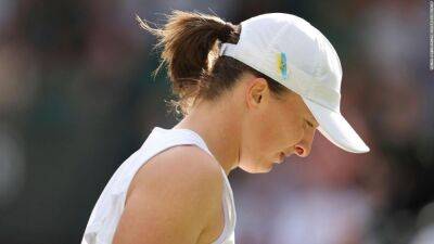 Polish tennis star Iga Swiatek's winning streak ends in defeat by France's Alizé Cornet at Wimbledon