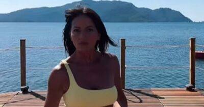 Davina McCall inundated with compliments as she struts her stuff in yellow bikini