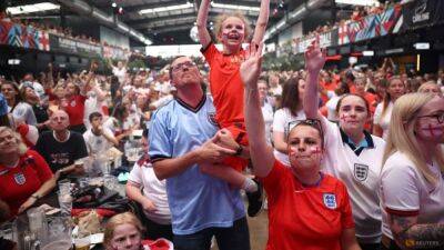 Red and white England fans gather in London for Women's Euro final - channelnewsasia.com - Sweden - Germany - Austria - London - county Prince William