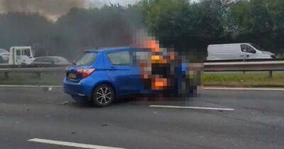 BREAKING: Car bursts into flames after crash on motorway with emergency services at scene - latest updates