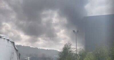 Thick plumes of smoke seen above Salford after heap of rubbish sets on fire at recycling centre