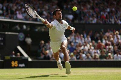 Djokovic battles from two sets down to reach 11th Wimbledon semi-final
