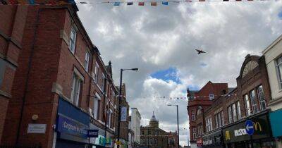 Bizarre row erupts over noisy BUNTING so loud it's 'ear bleeding' in Greater Manchester high street