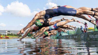 British Triathlon creates 'open' category for transgender athletes to compete after FINA swimming and diving ban