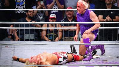 Bloodied Ric Flair wins 'last match' in front of family, WWE legends
