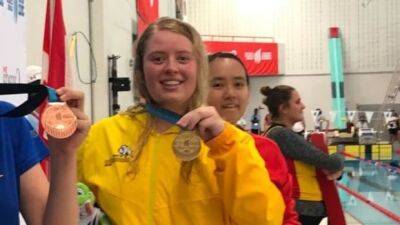 Special Olympics swimmer Teagen Purvis getting familiar with podium at Canada Summer Games
