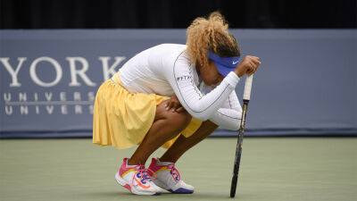 Naomi Osaka withdraws from first-round match with back injury