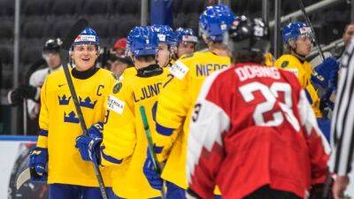 Sweden routs Austria to remain unbeaten at world juniors