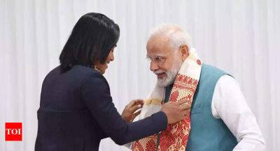 Nikhat Zareen gifts PM Narendra Modi boxing gloves, Hima Das gives traditional gamcha