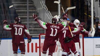 Latvia beats Czechs to reach WJC quarterfinals