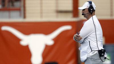 Texas falls outside preseason college football rankings despite first-place vote in coaches poll