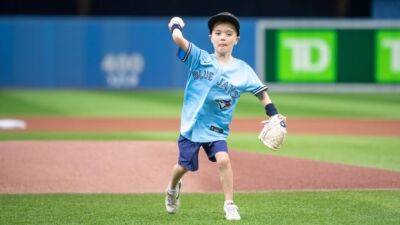 7-year-old Saskatoon heart surgery survivor throws first pitch at Blue Jays game