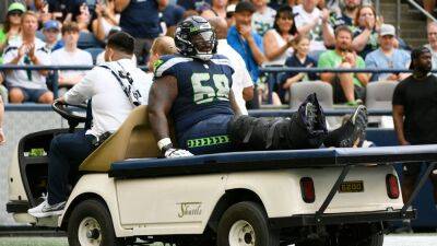 Seattle Seahawks' Damien Lewis carted off field with ankle injury