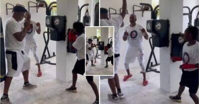 Lennox Lewis shows off his insane hand speed as he puts on summer camp for underprivileged kids