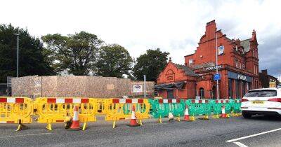 Town's green will remain a huge hole for another YEAR due to 'complex' Metrolink tunnel repairs