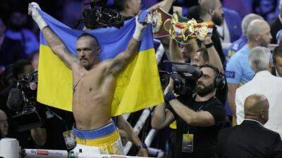 Ukraine's Usyk retains world heavyweight titles with split decision win over Joshua in rematch