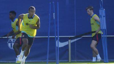Jules Kounde trains with Barcelona as he awaits registration - in pictures