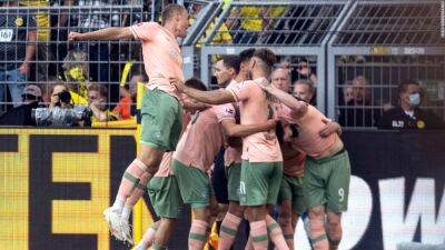Gregor Kobel - Raphael Guerreiro - Julian Brandt - Borussia Dortmund suffers shock 2-3 defeat after Werder Bremen triumphs with three late injury-time winners - edition.cnn.com - Britain - Germany - Portugal - Scotland -  Sana - county Lee - county Oliver
