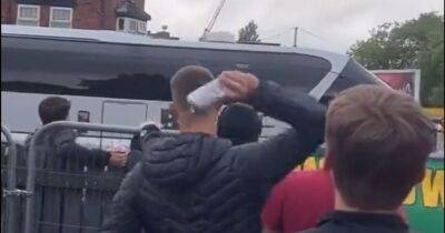 Driver's fury after terrified children forced to hide from 'yob' Manchester United fans who hurled beer at coach
