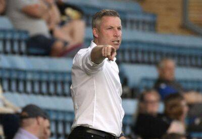 Gillingham manager Neil Harris reacts to penalty shoot-out victory over Exeter City in Carabao Cup second round