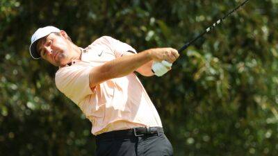 McIlroy can't make ground on surging Scheffler