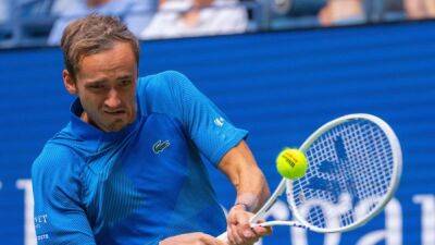 Medvedev whacks aside American Kozlov to begin US Open title defence
