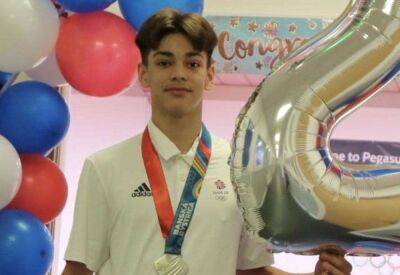 Oakley Banks wins silver medal in the artistic gymnastics event at the European Youth Olympic Festival final alongside Danny Crouch and Reuben Ward
