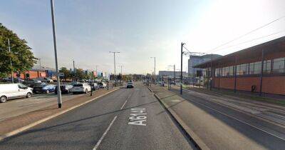 Woman rushed to hospital after being hit by car on major Manchester road