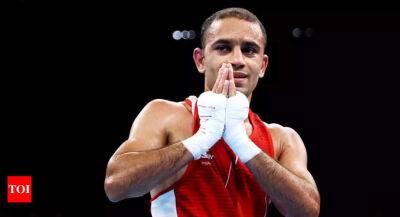 CWG 2022: Amit Panghal enters semi-final to assure fourth boxing medal - timesofindia.indiatimes.com - Scotland - India