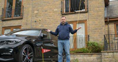 Man charges £50,000 electric BMW through first floor window after being forced to remove outdoor charging point