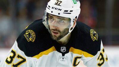 Respected captain Bergeron returns to Bruins on 1-year deal loaded with incentives
