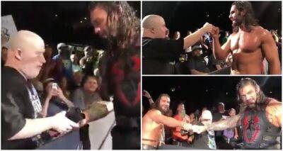 Roman Reigns & Seth Rollins' wholesome moment with fan at WWE live event in 2018