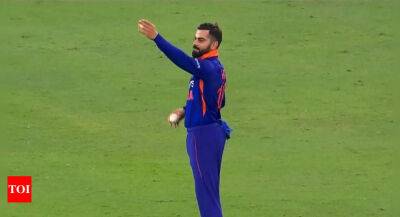 Rohit Sharma - Watch: Virat Kohli bowls for the first time in a T20I in six years - timesofindia.indiatimes.com - India - Hong Kong -  Hong Kong