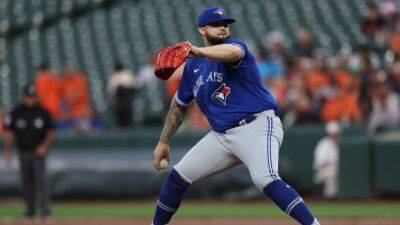 Rob Manfred - Tony Clark - MLB adopts pitch clock, shift limits, bigger bases for 2023 - cbc.ca -  Boston -  Chicago