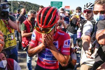 Tearful Evenepoel set to win Vuelta after protecting lead